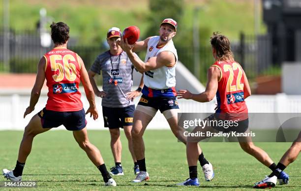 James Madden gets a handball away during a Brisbane Lions AFL training session at Brighton Homes Arena on February 15, 2023 in Brisbane, Australia.