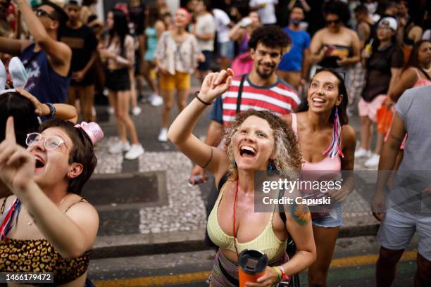 group of friends celebrating carnival party - brazilian carnival stock pictures, royalty-free photos & images
