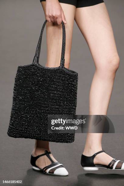 Model on the catwalk, bag detail