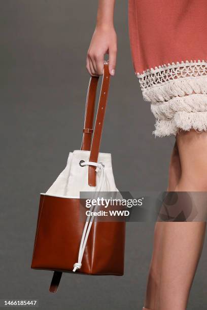 Model on the catwalk, bag detail