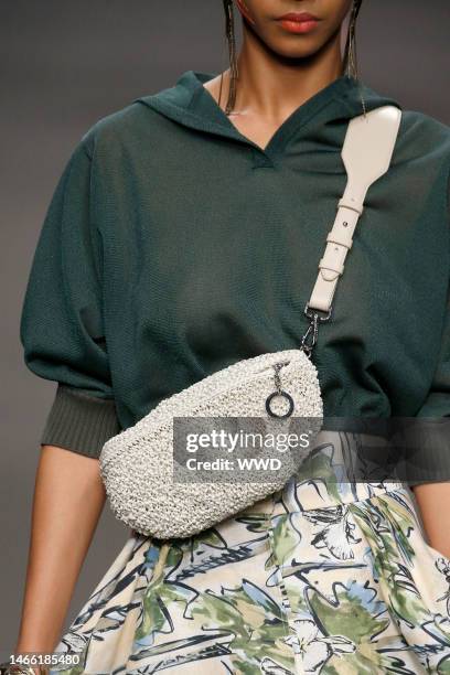 Model on the catwalk, bag detail