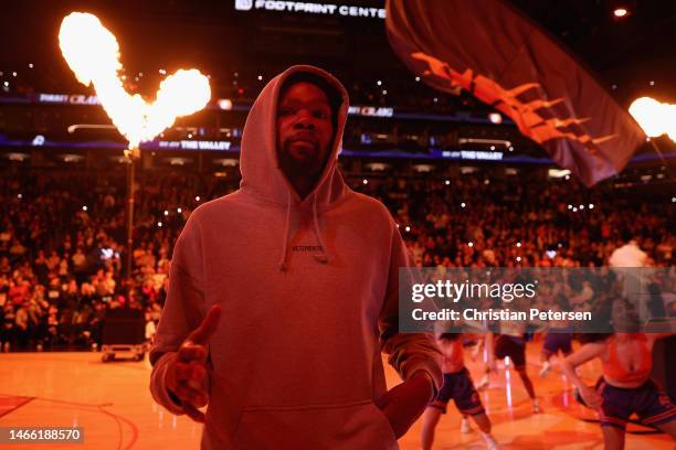 Kevin Durant of the Phoenix Suns walks onto the court before the first half of the NBA game against the Sacramento Kings at Footprint Center on...