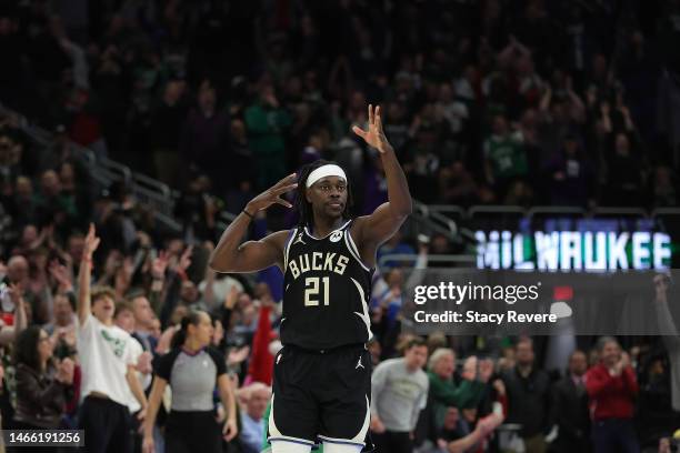 Jrue Holiday of the Milwaukee Bucks reacts to a three point shot in overtime against the Boston Celtics at Fiserv Forum on February 14, 2023 in...