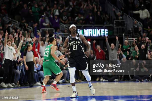 Jrue Holiday of the Milwaukee Bucks reacts to a three point shot in overtime against the Boston Celtics at Fiserv Forum on February 14, 2023 in...