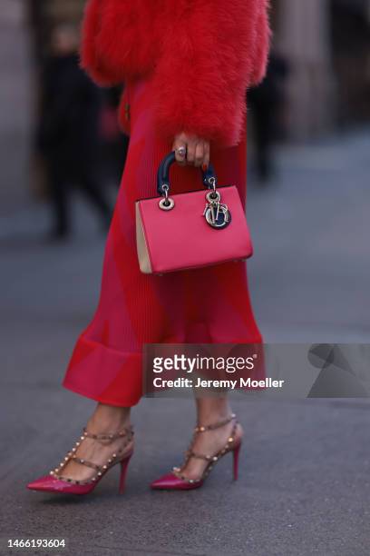 Olga Ferrara wearing Milly red rose fake fur coat, Milly long knit rose red dress, Valentino rose heels, Lady Dior matching leather bag, Pharaoun...