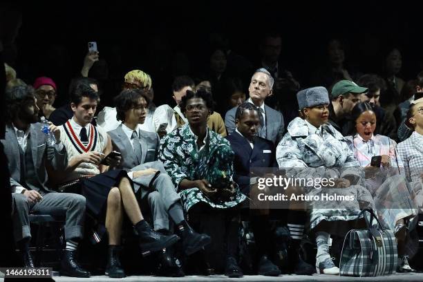 Lil Nas X, Pusha T, Queen Latifah, and Eboni Nichols, attend the Thom Browne show during New York Fashion Week: The Shows at The Shed on February 14,...