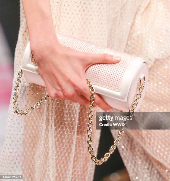 Model on the catwalk, bag detail