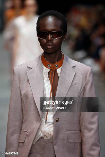 Model on the catwalk, sunglasses detail