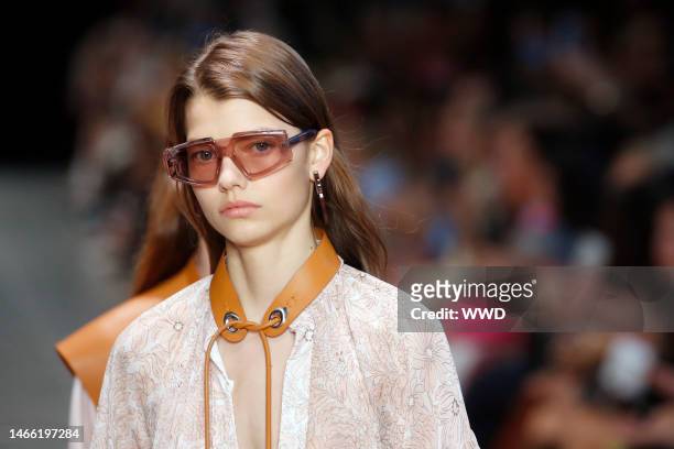 Model on the catwalk, sunglasses detail