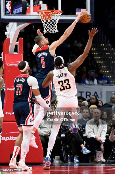 Kristaps Porzingis of the Washington Wizards blocks a shot by Myles Turner of the Indiana Pacers at Capital One Arena on February 11, 2023 in...