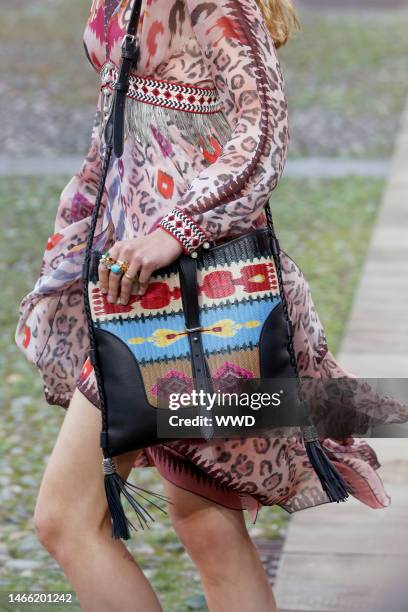 Model on the catwalk, bag detail