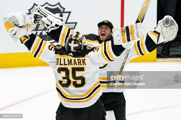 Linus Ullmark of the Boston Bruins is congratulated by Jeremy Swayman of the Boston Bruins after the game against the Dallas Stars at American...