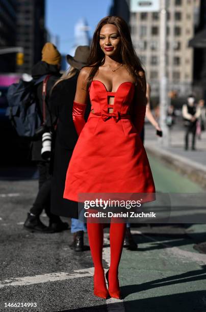 Actress Savannah Smith is seen wearing a red Pamella Roland dress outside the Pamella Roland show during New York Fashion Week F/W 2023 on February...