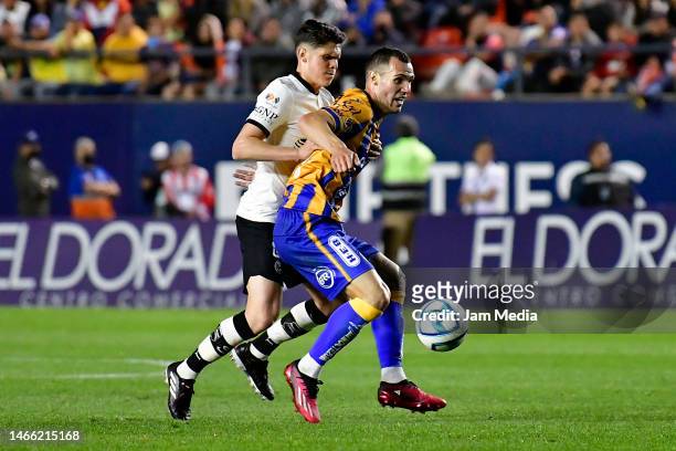 Israel Reyes of America fights for the ball with Unai Bilbao of San Luis during the 7th round match between Atletico San Luis and America as part of...