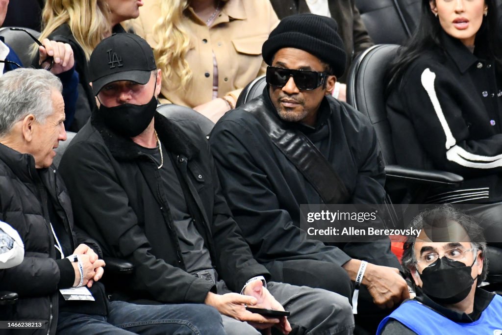 Que Tip Rapper Leonardo DiCaprio and rapper Q-Tip attend a basketball game between ...