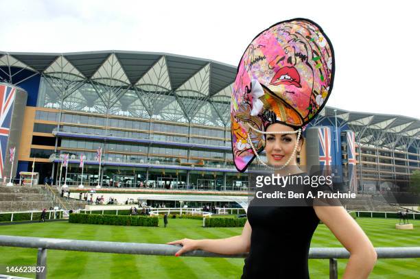 Model Carla Creegan wears a hat commissioned by Castle Galleries, inspired by the work of UK artist Louise Dear at Ladies Day Royal Ascot at Ascot...