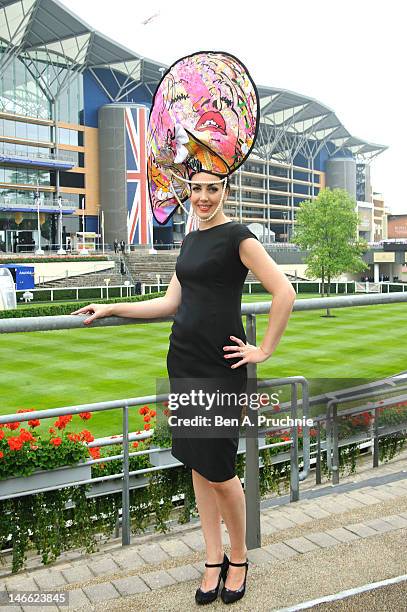 Model Carla Creegan wears a hat commissioned by Castle Galleries, inspired by the work of UK artist Louise Dear at Ladies Day Royal Ascot at Ascot...