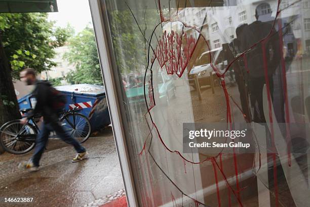 Man walks past the vandalized Schiller Backstube bakery in Neukoelln district on June 21, 2012 in Berlin, Germany. Five unknown assailants smashed...