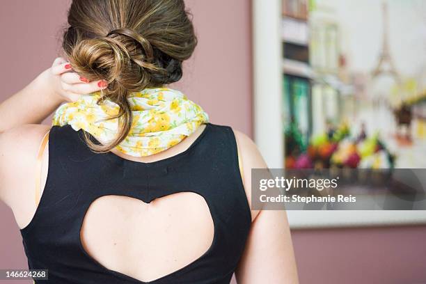 girl with her hair in loose bun - hair bun scarf woman stock pictures, royalty-free photos & images