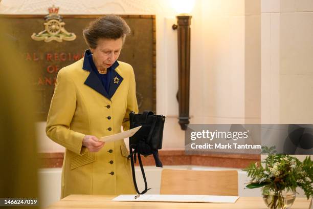 Princess Anne, Princess Royal prepares to sign the guest book after the Service of Remembrance on February 15, 2023 at Pukeahu National War Memorial...