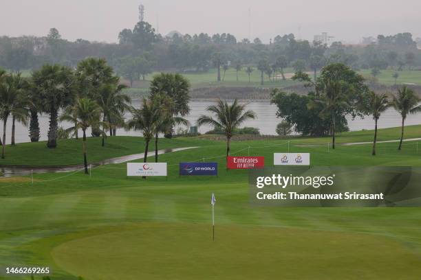Rain falls over the 18th green after play was suspended during a pro-am tournament prior to the Thailand Classic at Amata Spring Country Club on...