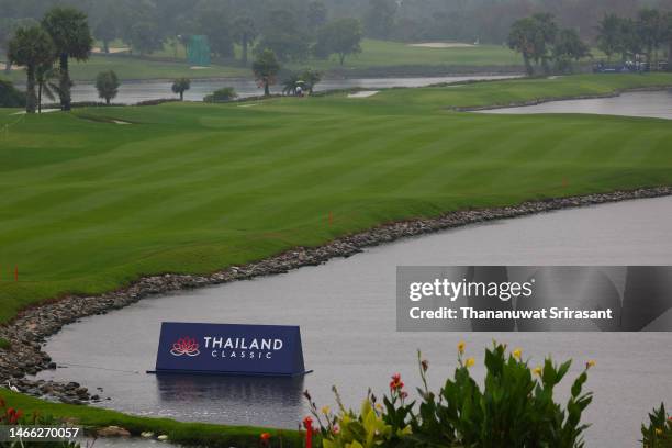 Rain falls over the 18th fairway after play was suspended during a pro-am tournament prior to the Thailand Classic at Amata Spring Country Club on...