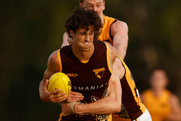Max Ramsden of the Hawks is tackled by Josh Weddle of the Hawks during the Hawthorn Hawks AFL intra club match at La Trobe University on February 15,...