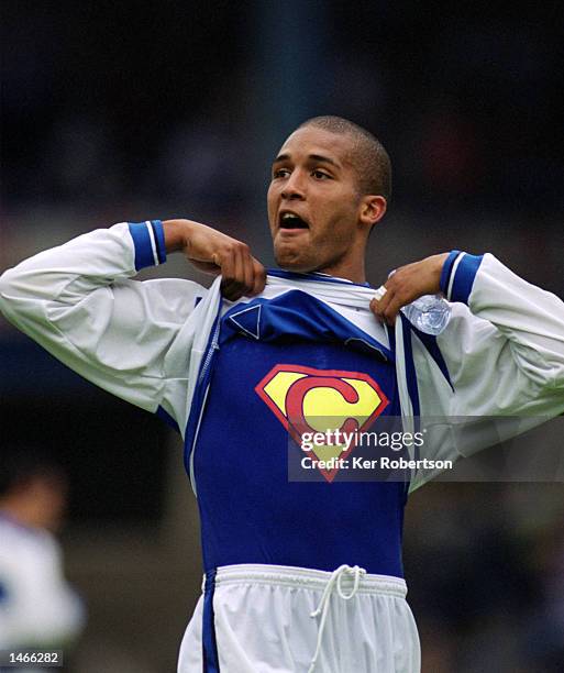 Clarke Carlisle of Queens Park Rangers shows off his Superman t-shirt during the Nationwide League Division Two match between Queens Park Rangers and...