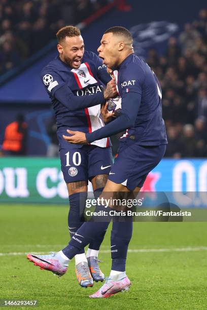 Kylian Mbappe of Paris Saint Germain celebrates with team-mate Neymar after scoring a goal that is lated ruled out by VAR during the UEFA Champions...