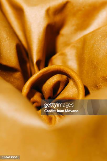 deflated balloon - deflated inflatable stock pictures, royalty-free photos & images