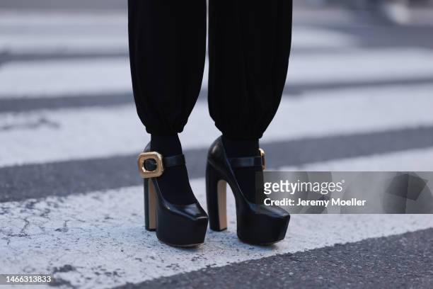 Lenia Perez seen wearing black Norma kamali jumpsuit, black Bottega veneta platform shoes during New York Fashion Week on February 13, 2023 in New...