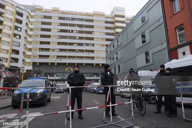 Police outside an apartment building at Kottbusser Tor in Kreuzberg district that houses a new police station on the day of the station's official...