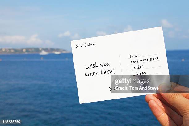 postcard from the seaside to a friend - postkarte stock-fotos und bilder