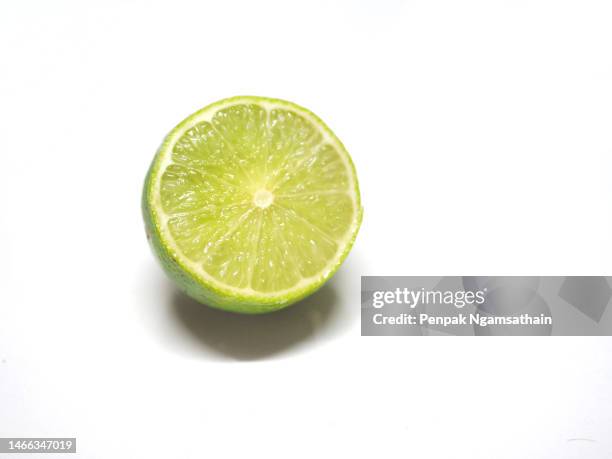 half a lemon on white background - half full stock pictures, royalty-free photos & images