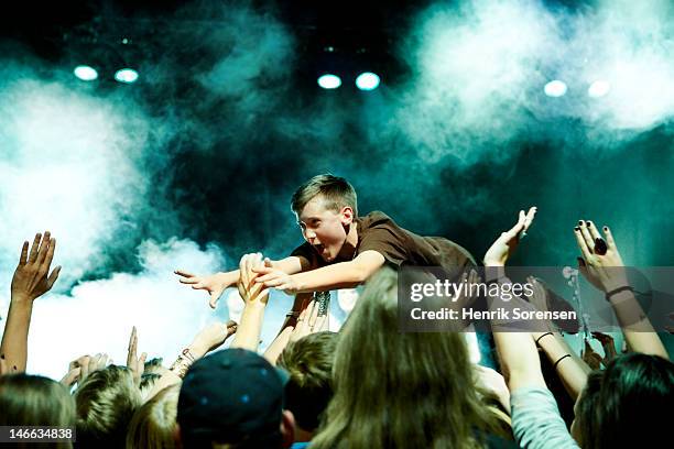 rock concert - crowdsurfing stock pictures, royalty-free photos & images