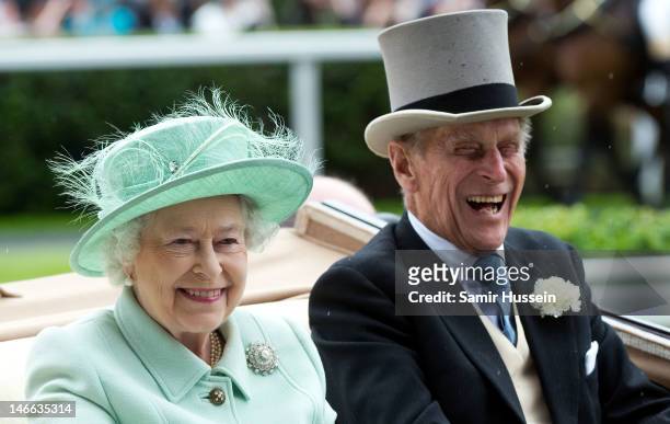 Queen Elizabeth II and Prince Philip, Duke of Edinburgh arrive by carriage on Ladies Day of Royal Ascot 2012 at Ascot Racecourse on June 21, 2012 in...