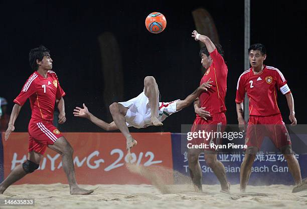 Mohammad Ahmadzadeh of Iran over head kicks against Aihaiti Liyihanmu of China during the Beach Soccer Men's Gold Medal Match between Iran and China...