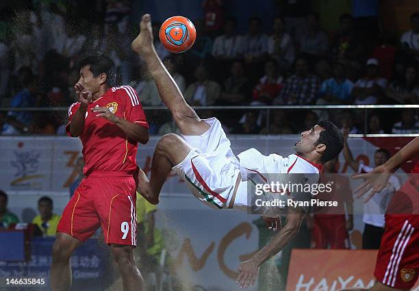 Mohammadali Mokhtari Hassanabad of Iran kicks at goal against Hao Qiu of China during the Beach Soccer Men's Gold Medal Match between Iran and China...