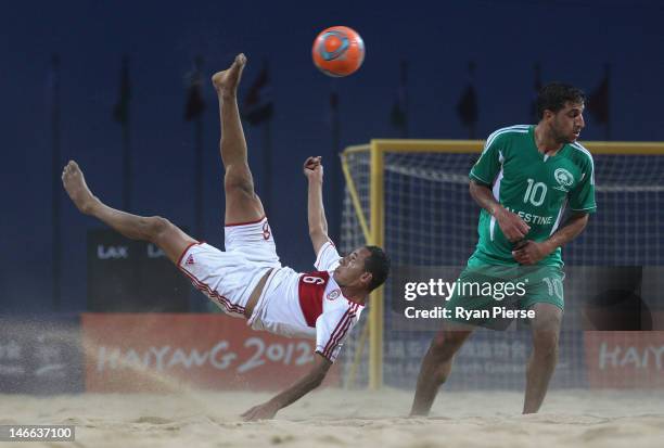 Mohamad Mechleb Matar of Lebanon kicks at goal against Mohammed Barakat of Palestine during the Beach Soccer Men's Bronze Medal Match between...