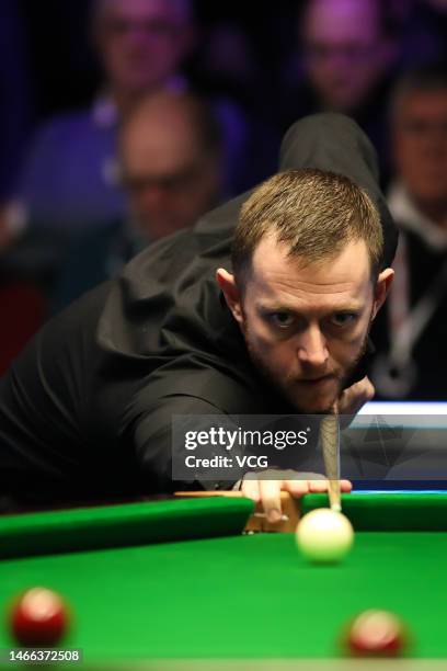 Mark Allen of Northern Ireland plays a shot in the first round match against Mitchell Mann of England on day three of 2023 Betvictor Welsh Open at...