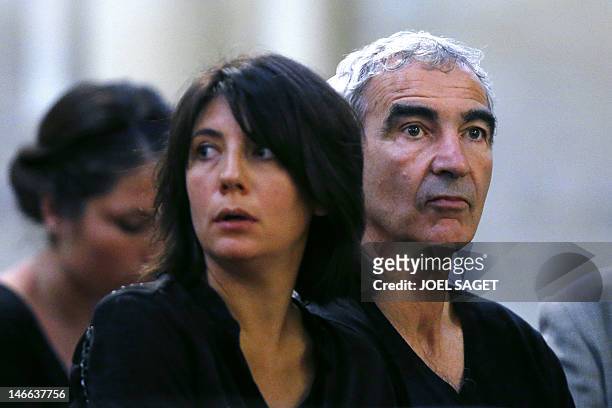 French football national team former coach Raymond Domenech and her companion, TV host Estelle Denis, attend the funeral ceremony of French...