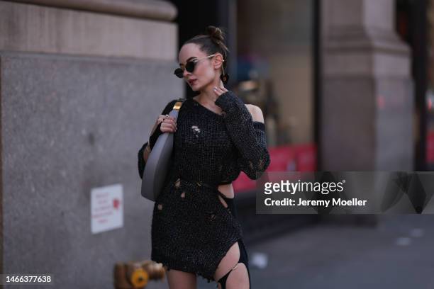 Katya Bychkova seen wearing Gucci sunglasses with heart shaped chain details, NBD dark grey off-shoulder knit sweater dress with cut-outs, NAEITA...