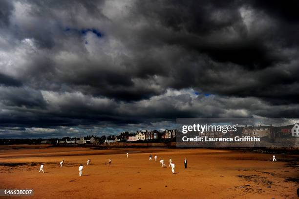 Cricketers from the Ship Inn Cricket Club play on the beach on August 29, 2010 in Elie, Scotland.