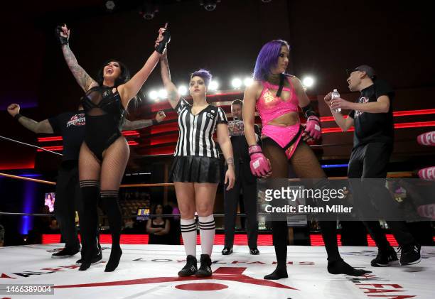 Katie "The Bombshell" Forbes, referee Sarah Wolfe, host and ring announcer A.J. Kirsch, Salina de la Renta and pink team coach Joel Kane react as...