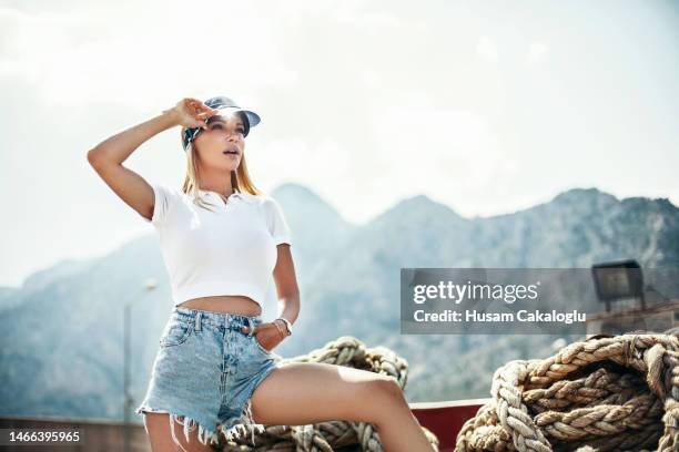 woman watching around on giant ship ropes. - diminished stock pictures, royalty-free photos & images