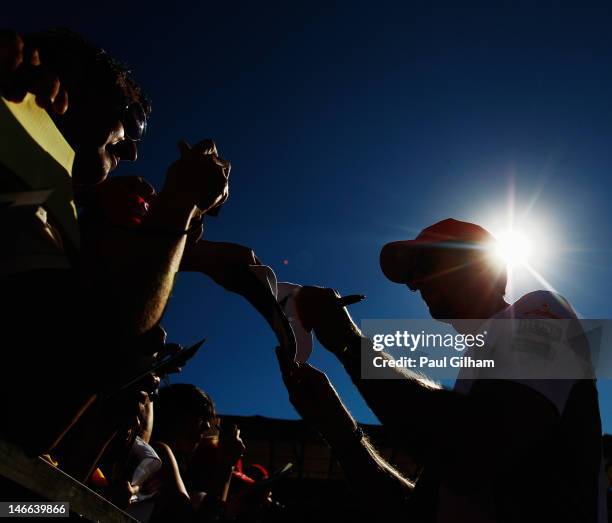 Jenson Button of Great Britain and McLaren signs autographs at the drivers autograph session during previews to the European Grand Prix at the...