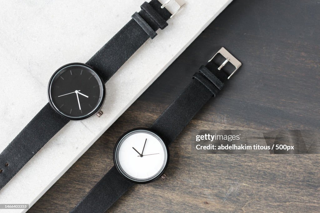 High angle view of wristwatch with wristwatch on table,Italy