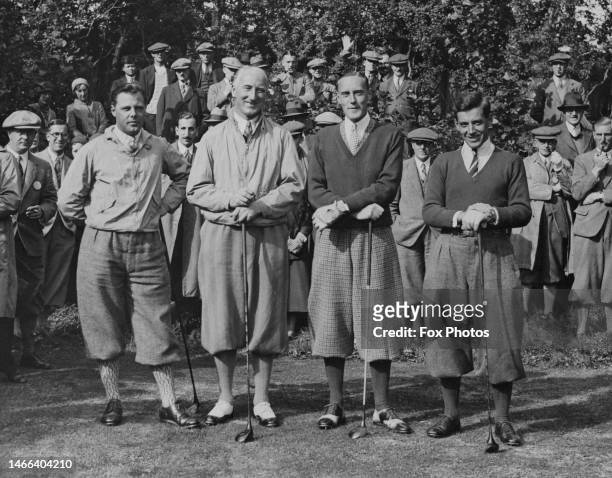 British golfers Percy Alliss , Arthur Havers , unidentified and Arthur Lacey pose for a photograph during their exhibition golf match on 2nd October...