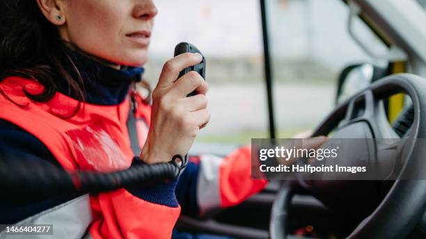 close-up of rescuer woman sitting in ambulance car. - emergency services occupation ストックフォトと画像