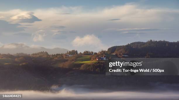 scenic view of landscape against sky,melhus municipality,norway - farm norway stock pictures, royalty-free photos & images